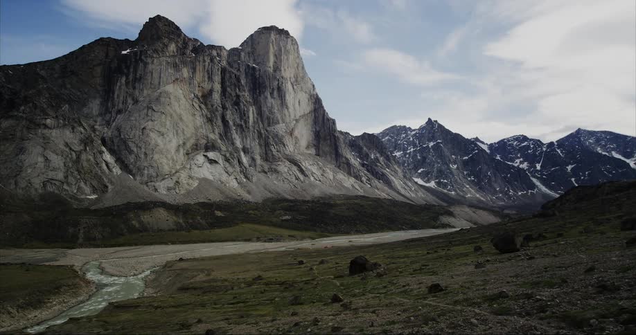 Timelapse of clouds floating above Mount Thor on Baffin Island in the Arctic Summer season