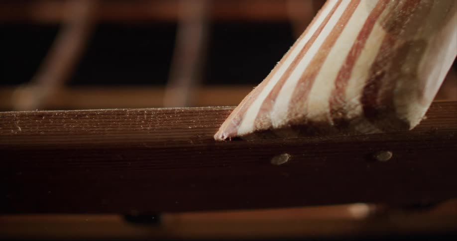 Narrow pieces of wood stretch across the frame of a traditional built sea kayak