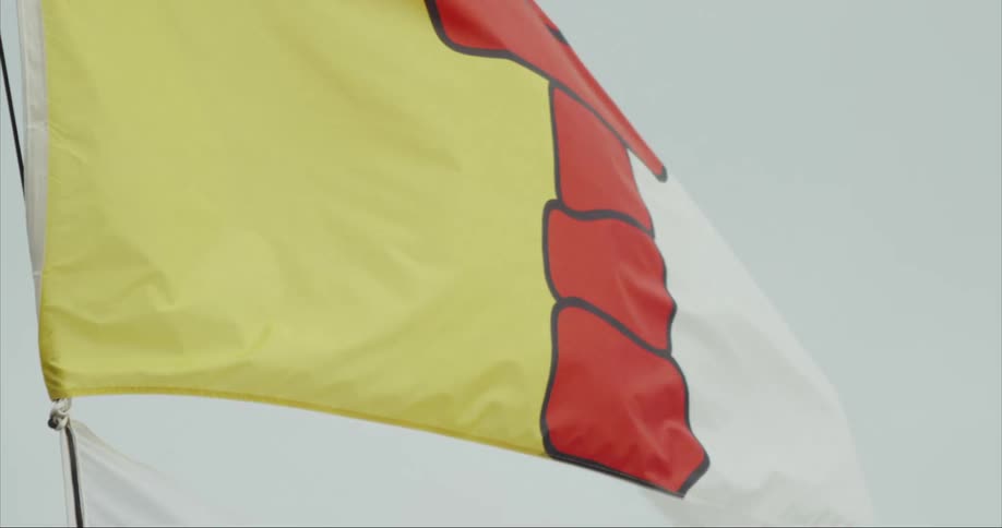The Nunavut Flag proudly waiving in the strong wing