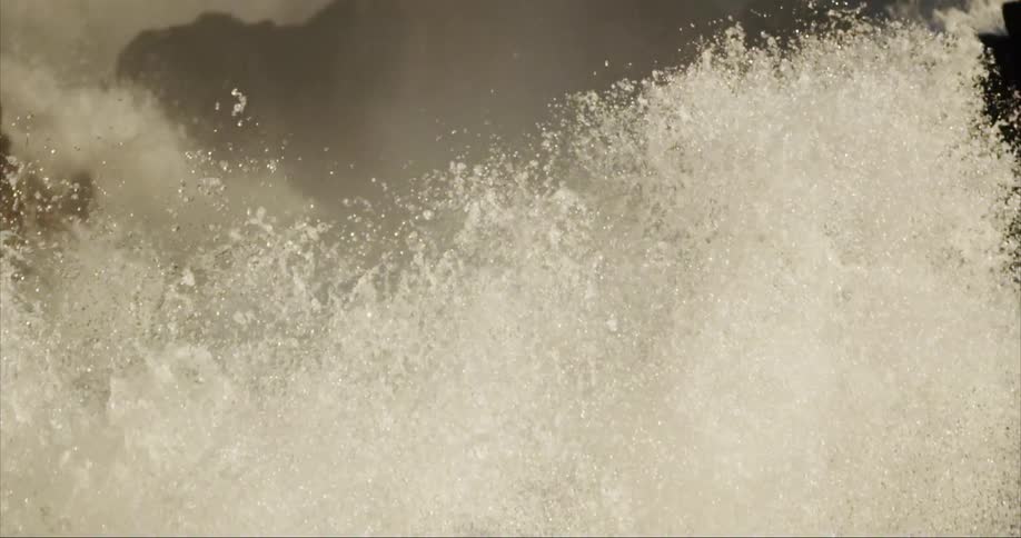 Exploding plumes of fresh water as this waterfall cascades down a granite cliff face on Baffin Island