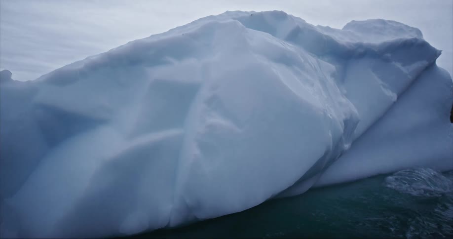 Sea water splashes against this melting icberg in the summer months on Baffin Island