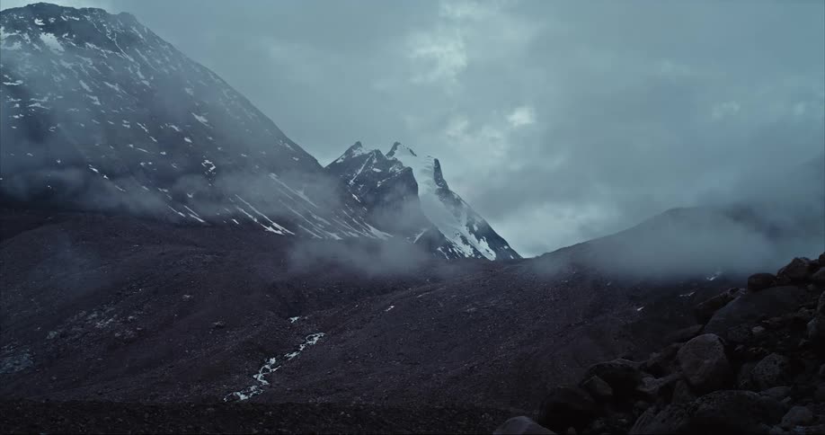 storm clouds pass by a granite peak in real time on Baffin Island