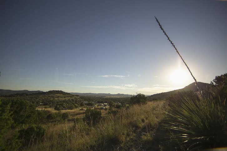 Clouds streaming over am remote area as the sun rises