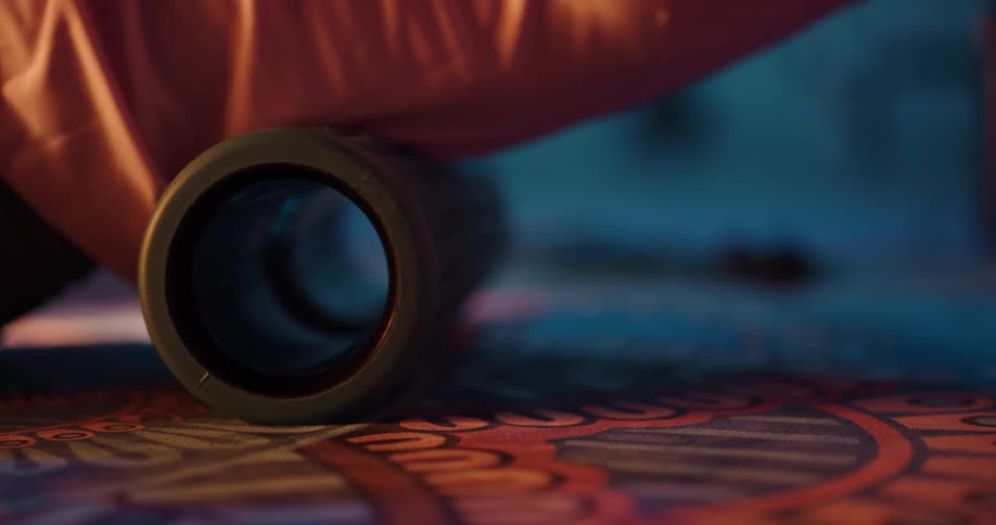 A person is stretching on a back roller