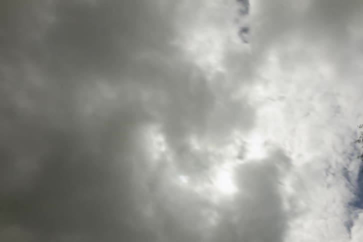 Clouds move across a clear sky