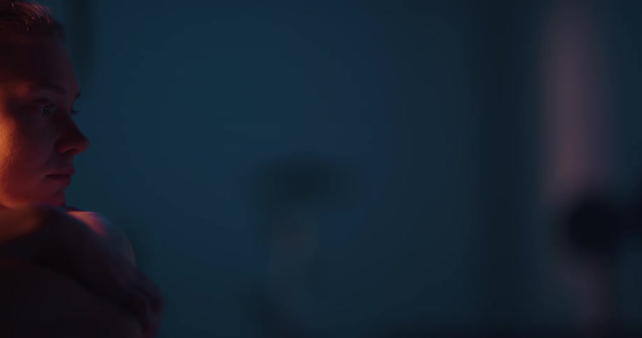 Side profile of woman looking into space in the gym