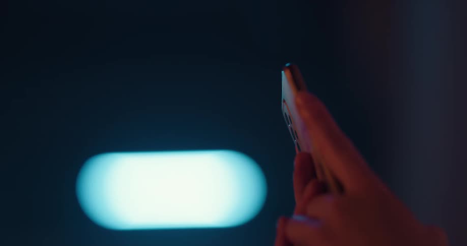 A woman texts on her smartphone