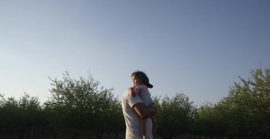 A father is carrying his daughter