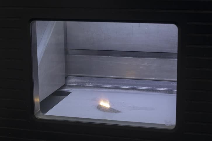 A machine with a laser is creating a pattern