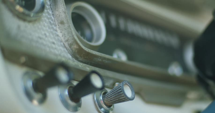 The key is in the ignition of an old automobile below the speedometer