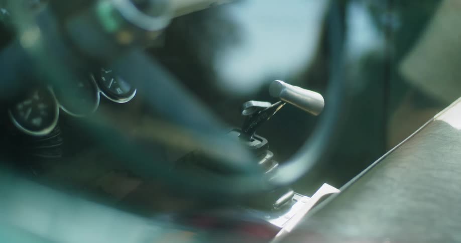 Close up of steering wheel and gear in classic car