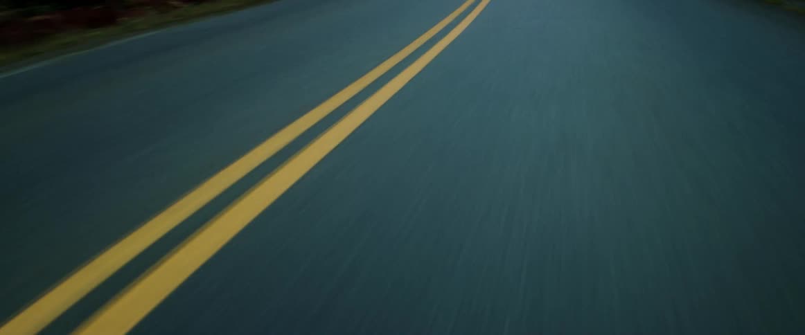 Vehicle drives on two lane highway