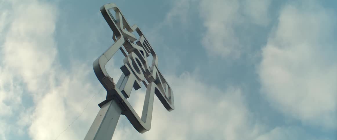 The East Van sign in Vancouver seen at sunrise with moving clouds