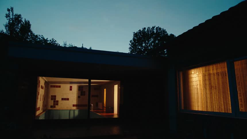 Lights glowing inside a house at night