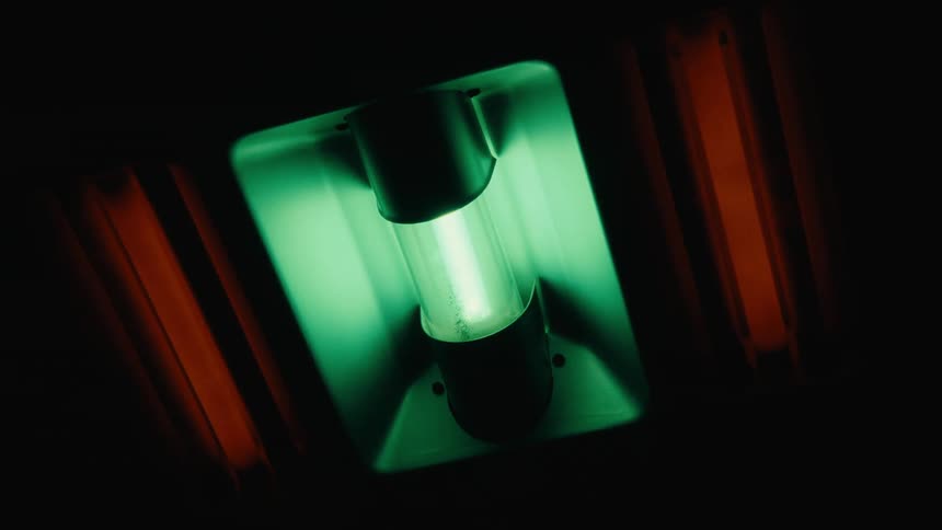 A close up of a green light