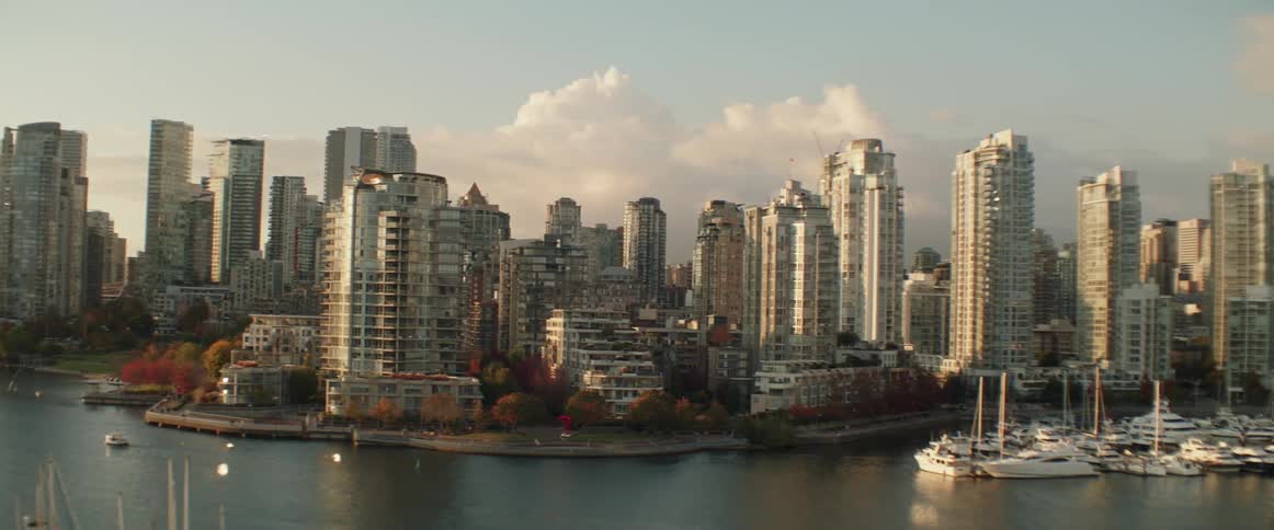 Panning shot of Vancouver city skyline and harbor