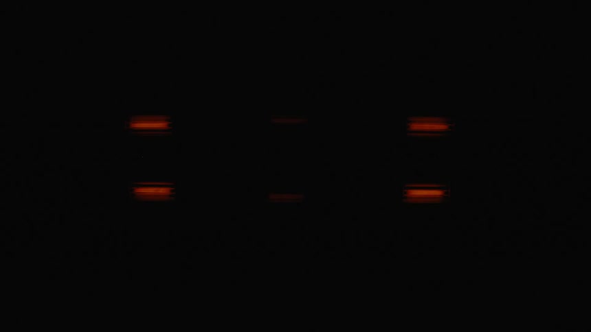 Lights slowly turn off in a dark room