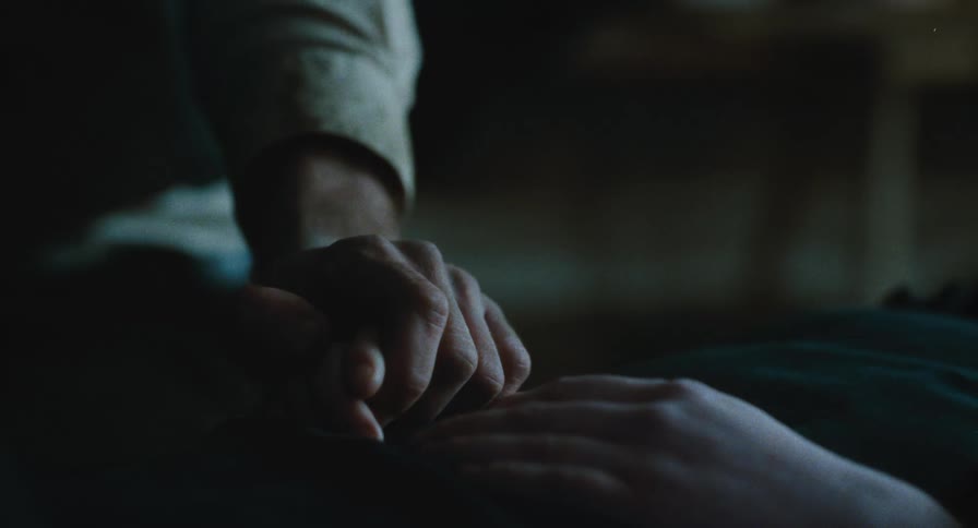 Close Up on holding hands with sick loved one
