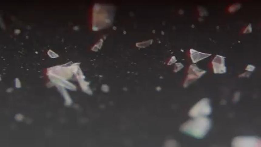 Broken shards of glass and flashing lights