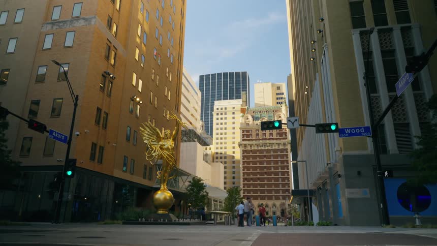 Timelapse of city sidewalk and a statue