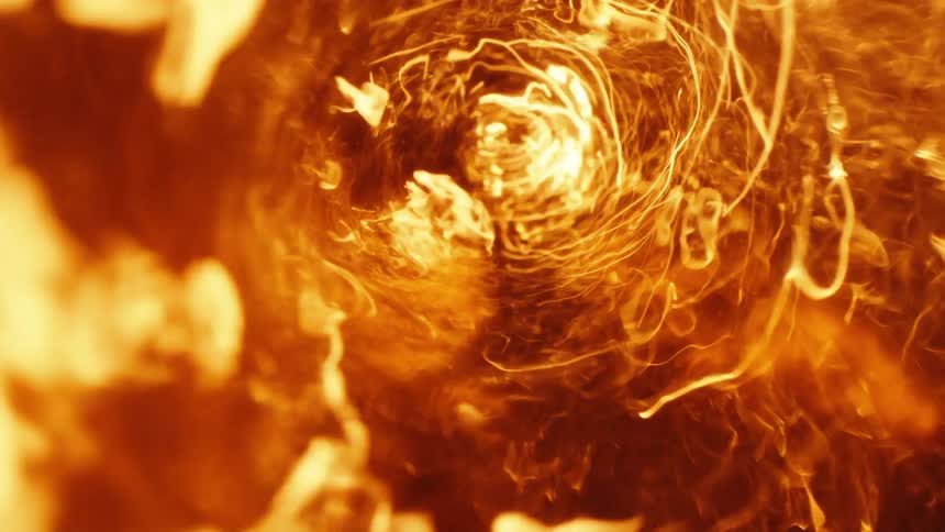 Light shines upon a deep orange whirlpool as sparks and particles spin in the vortex