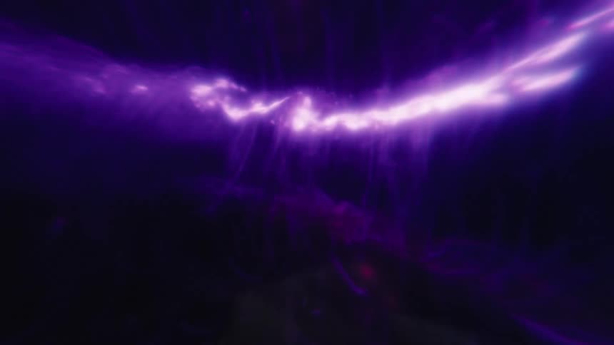 Light shines on a twister rapidly spinning in a purple environment as glowing particles rotate around the vortex