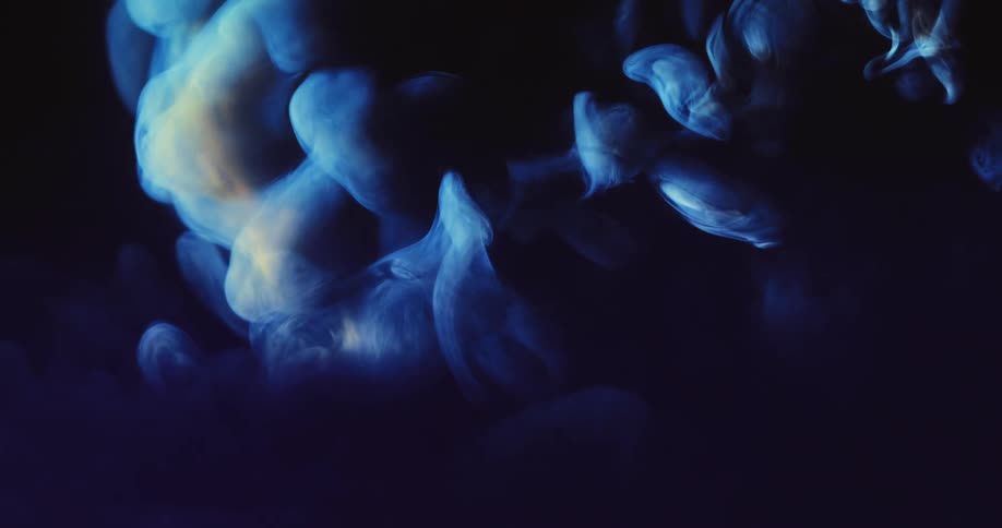 Blue smoke billowing through the air