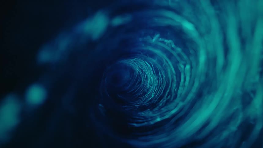 A rushing blue water vortex surges with kinetic energy and motion