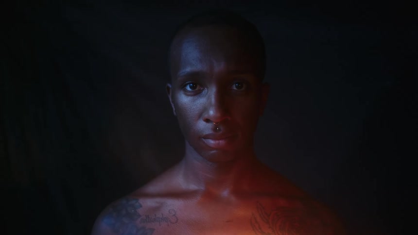 A man is staring in the dark room