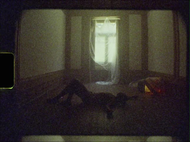 A man is lying on a hardwood floor with his arms stretched out as light shines in from the window