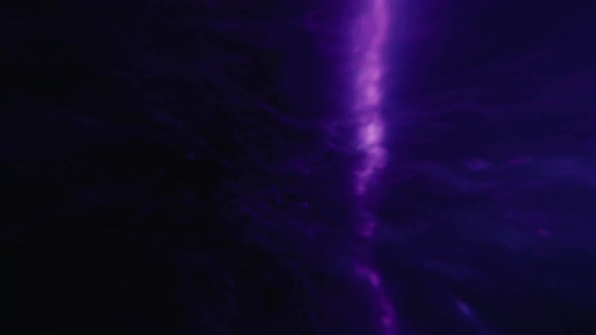A surge of purple electrical energy rapidly builds with explosive power
