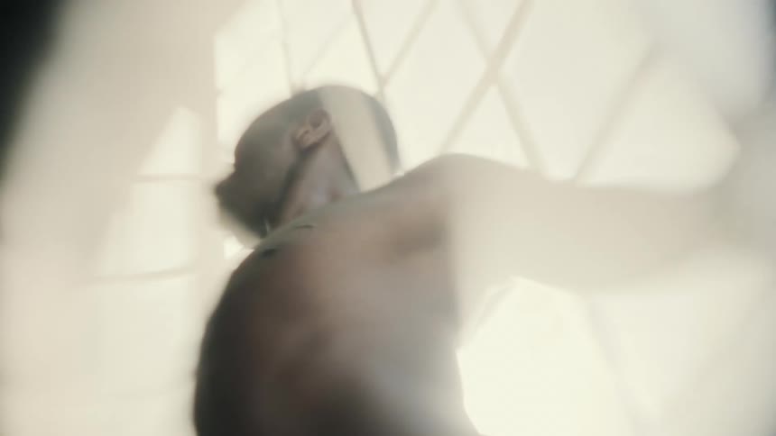 A person stretched out in the sunlight of the window