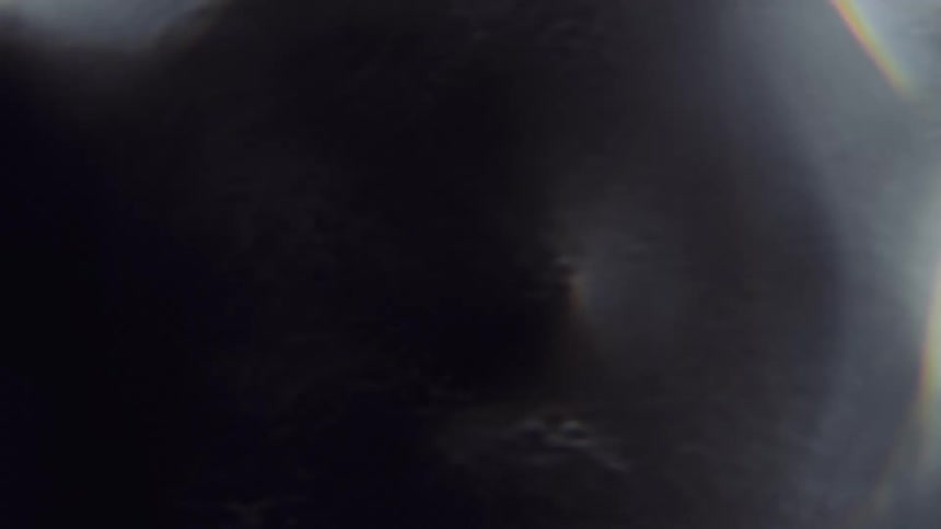 Ripples on surface obscure bright disks reflected by dark water