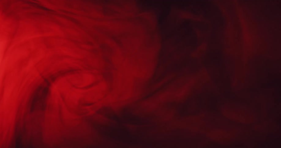 The red smoke swirls