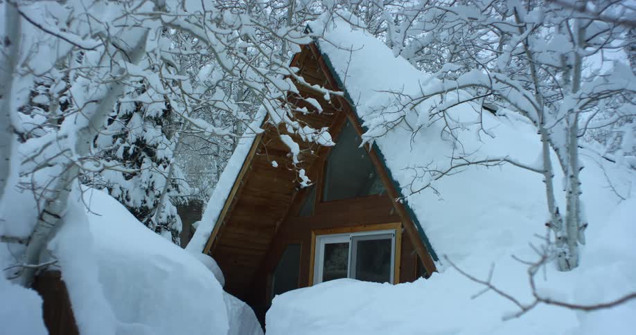 A house is covered in snow during the winter season
