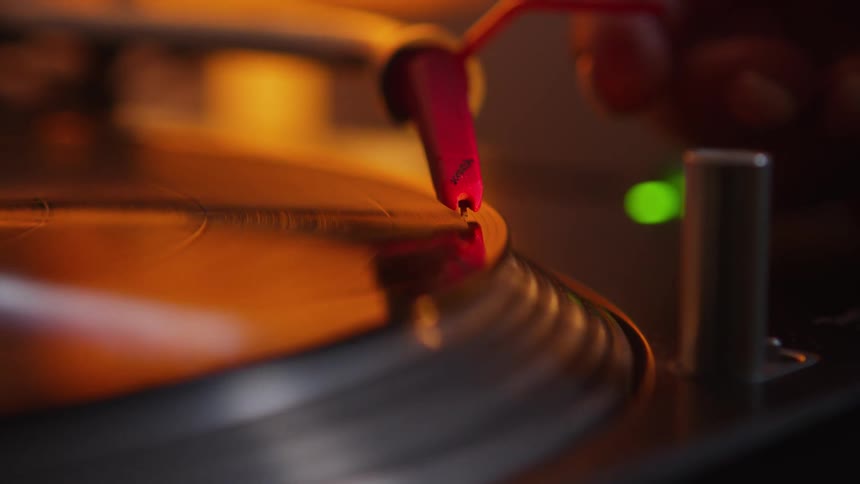 Close up view of a record player is displayed indoors