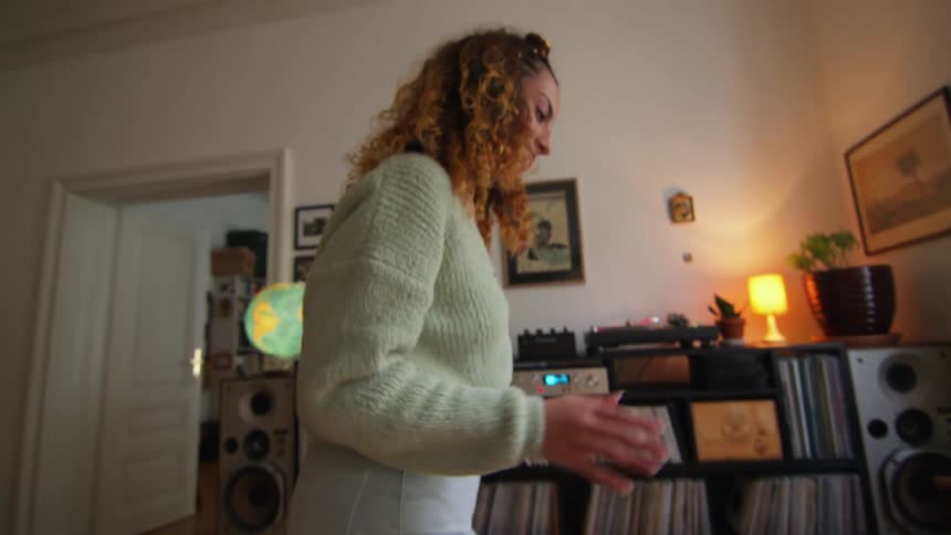 Woman dancing and grooving inside her house