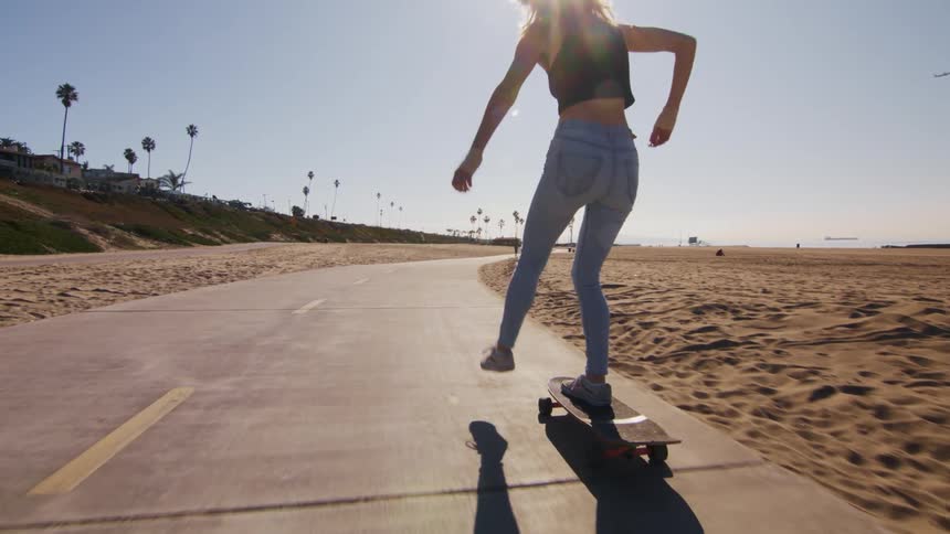 Woman riding on a skateboarder