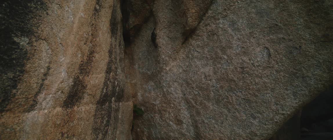 Aerial view of the stained surface of rock walls