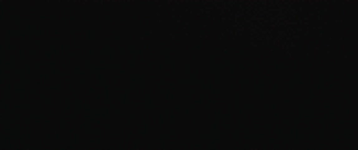 Lighting flashes across a dark sky during a storm at night