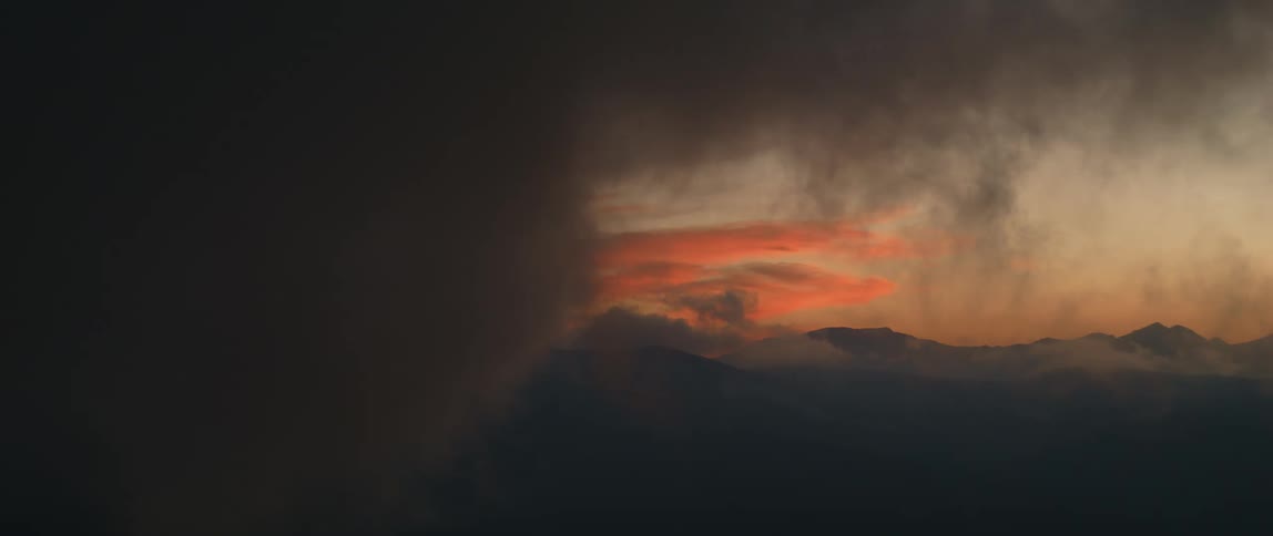 Landscape of dark clouds floating in the sky at sunset