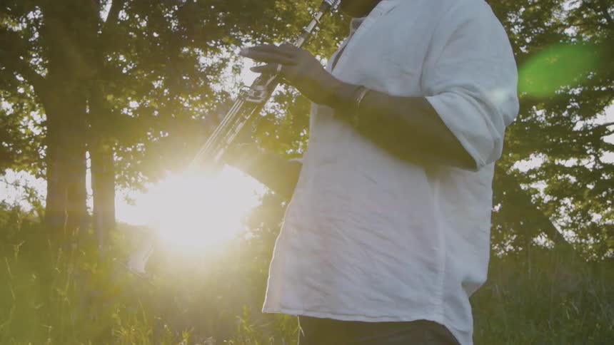 Man Playing Saxophone In Nature