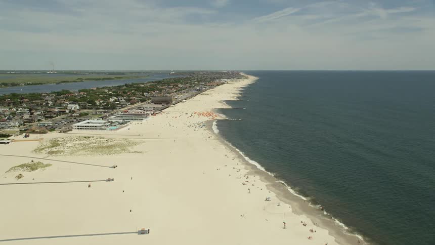 Fly over of sunbathers at Catalina Beach Club in Atlantic Beach Long Island NY with stunning views of the shoreline and coastline