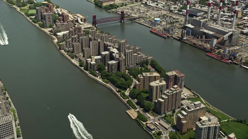 This is a aerial footage of apartment buildings in Roosevelt Island showcasing the residential neighborhood in New York City near the East River