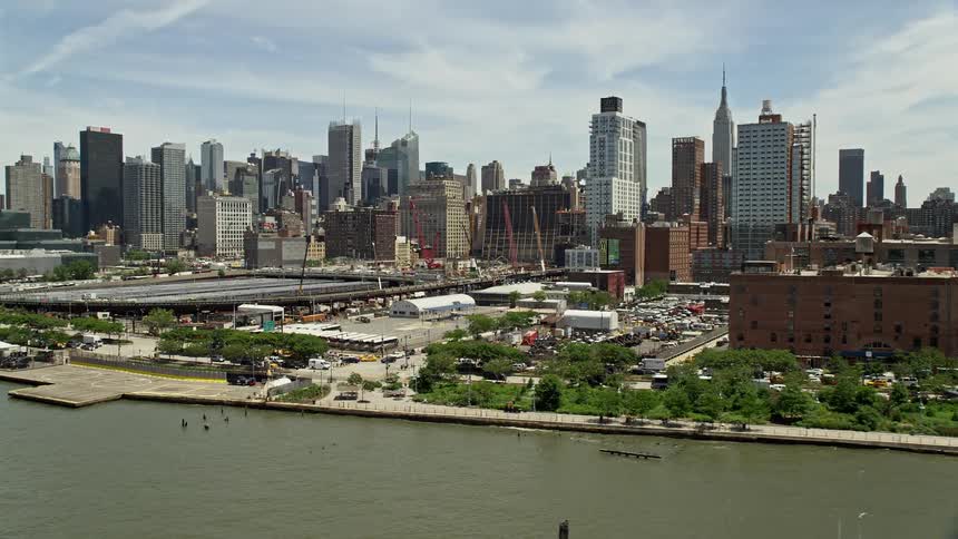 Aerial view of Starrett-Lehigh Building and Hudson Yards in New York City including Midtown Manhattan skyscrapers as the helicopter lands at the West 30th Street Heliport