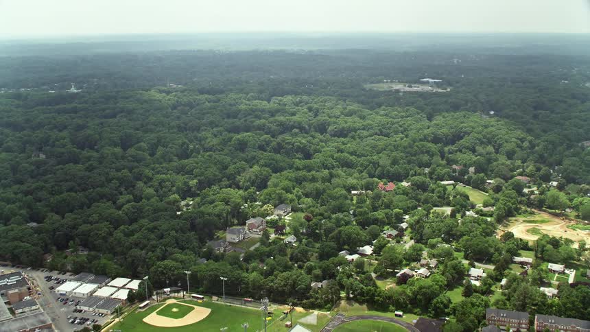 Approaching shopping centers in a suburban community on Little River Turnpike in Alexandria Virginia during daytime aerials