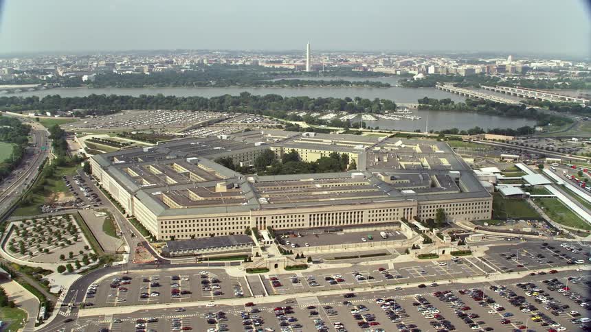 Aerial footage of The Pentagon in Washington DC with bridges spanning the Potomac river visible in the background