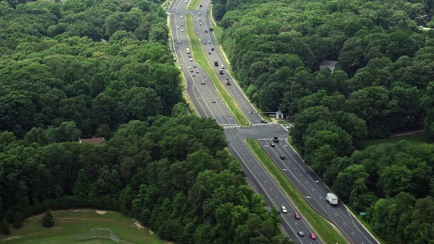 Light traffic flows smoothly along the four-lane Fairfax County Parkway as seen from an aerial view in Burke Virginia