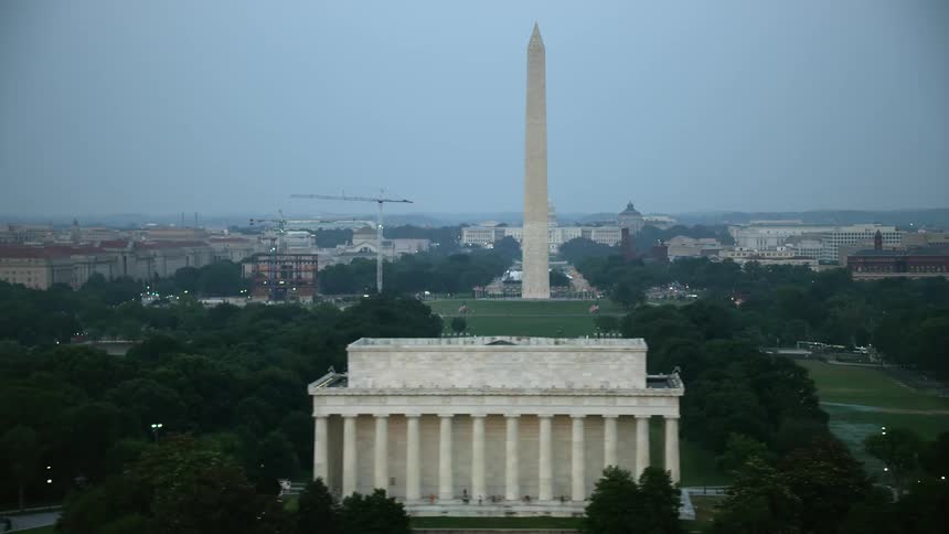 Aerial twilight footage of Washington DCs iconic structures including the Washington Monument United States Capitol Lincoln Memorial and National Mall