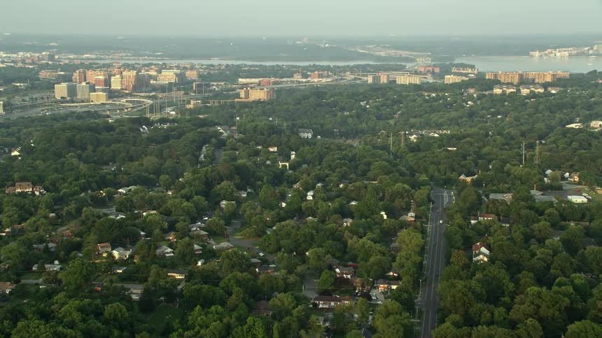 A stunning shot of a suburban area with baseball fields and row houses captured during sunset with an aerial in Alexandria Virginia